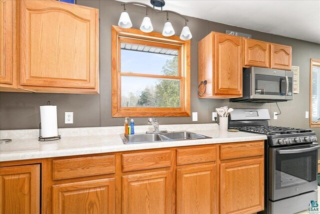 43240 County Highway D, Cable, WI 54821 - kitchen with stainless steel appliances, a sink, and light countertops