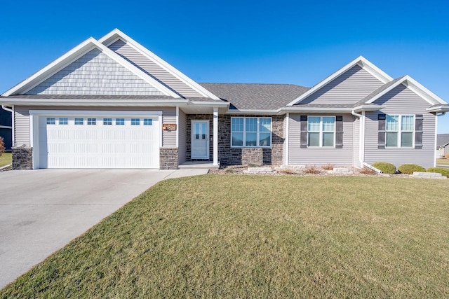 craftsman inspired home with a front lawn, concrete driveway, stone siding, and an attached garage