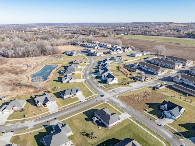 birds eye view of property with a residential view