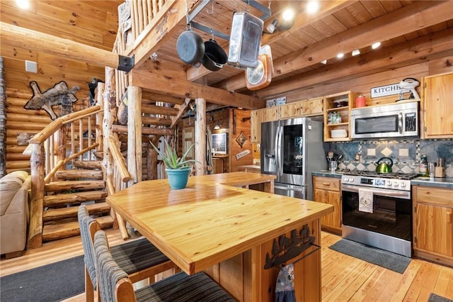 kitchen with beam ceiling, open shelves, stainless steel appliances, light wood-style flooring, and wooden ceiling