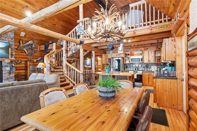 unfurnished dining area with a chandelier, stairway, wooden ceiling, and light wood-style floors