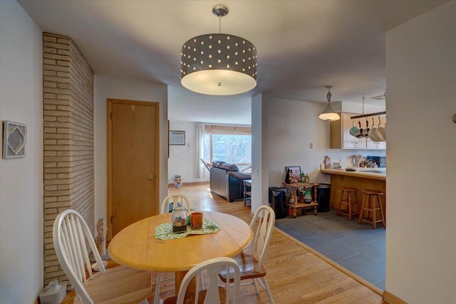 dining room featuring light wood finished floors