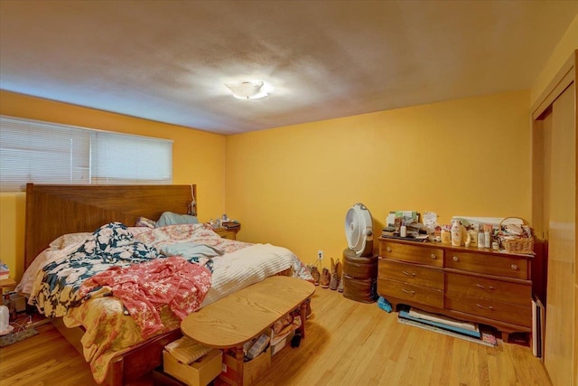 bedroom featuring wood finished floors