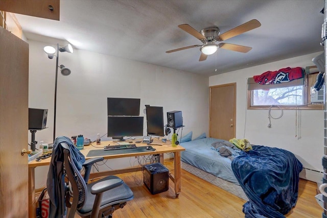 bedroom featuring ceiling fan and wood finished floors