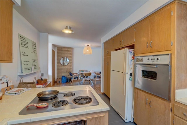 kitchen featuring tile counters and stainless steel appliances