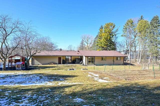 back of house featuring a yard