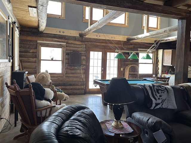 living room featuring a healthy amount of sunlight, pool table, a towering ceiling, and french doors