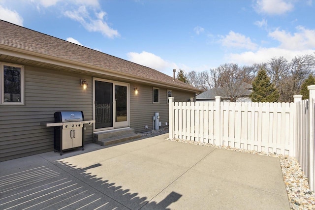 view of patio featuring entry steps, fence, and grilling area