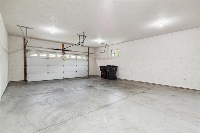 parking deck featuring a garage door opener