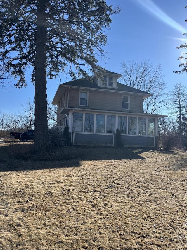 back of property featuring a sunroom