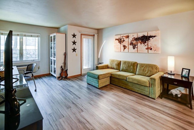 living room featuring light wood-style floors and baseboards