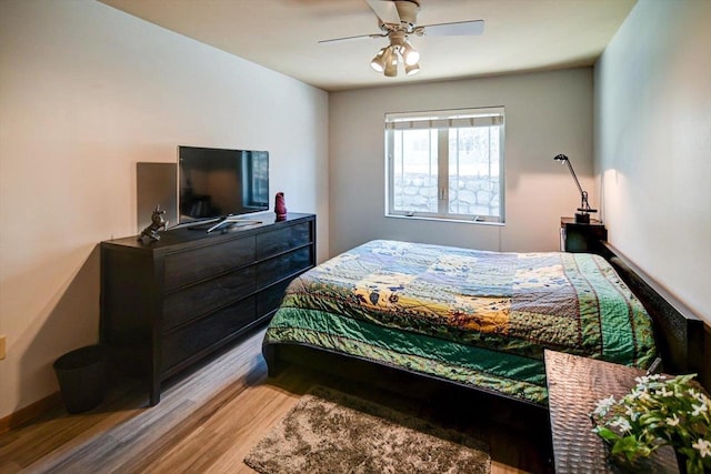 bedroom featuring ceiling fan and light wood-type flooring