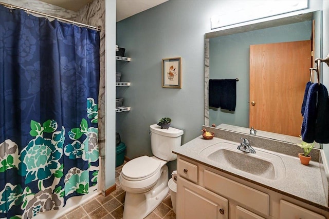 bathroom with toilet and vanity