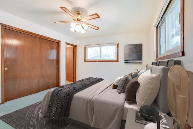 carpeted bedroom with a ceiling fan