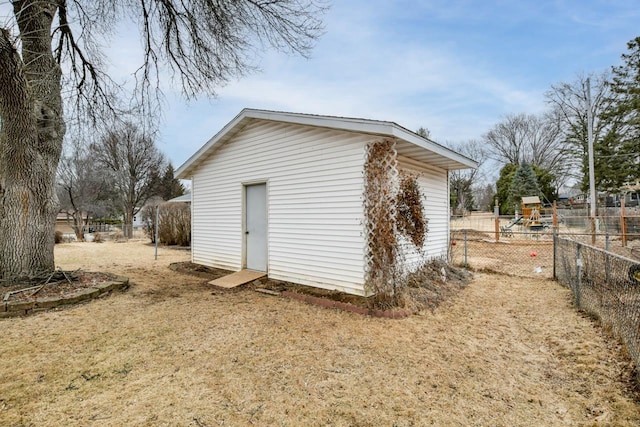 view of outdoor structure with an outbuilding and fence