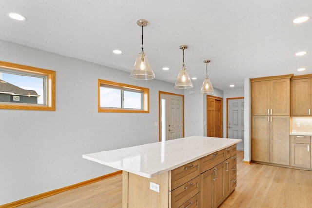 kitchen featuring recessed lighting, light countertops, and light wood finished floors