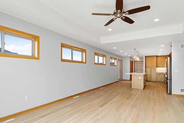 interior space featuring baseboards, visible vents, light wood-style flooring, and recessed lighting