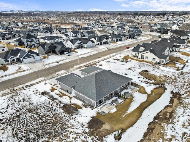 snowy aerial view featuring a residential view