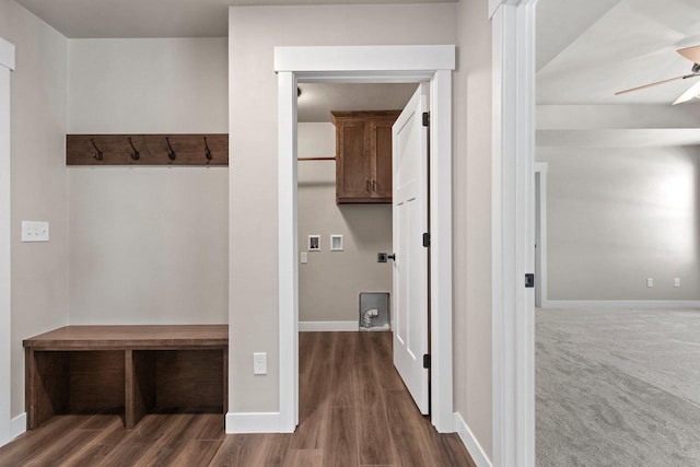 mudroom with a ceiling fan, dark carpet, dark wood finished floors, and baseboards