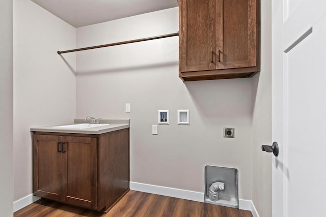 laundry area with dark wood-type flooring, washer hookup, hookup for an electric dryer, and a sink