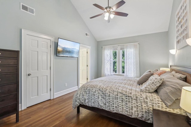 bedroom featuring high vaulted ceiling, baseboards, visible vents, and wood finished floors