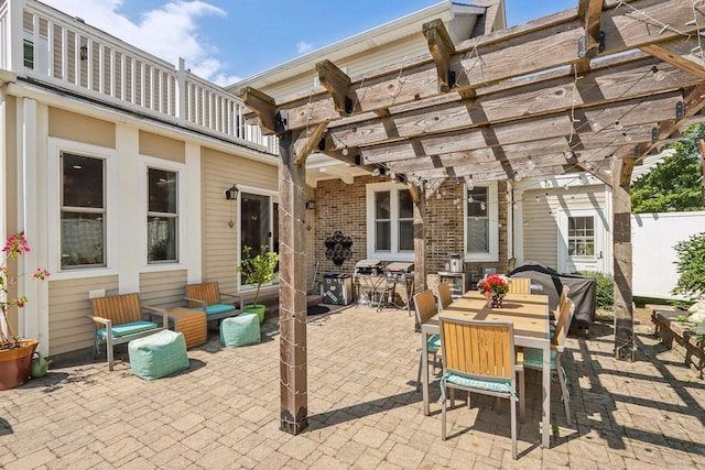 view of patio / terrace featuring fence, outdoor dining area, and a pergola