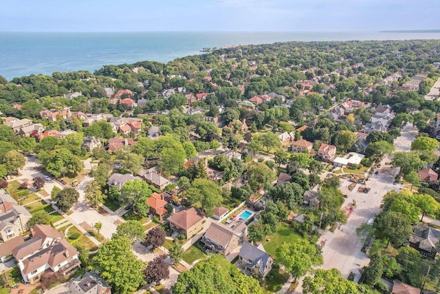 birds eye view of property with a water view and a residential view