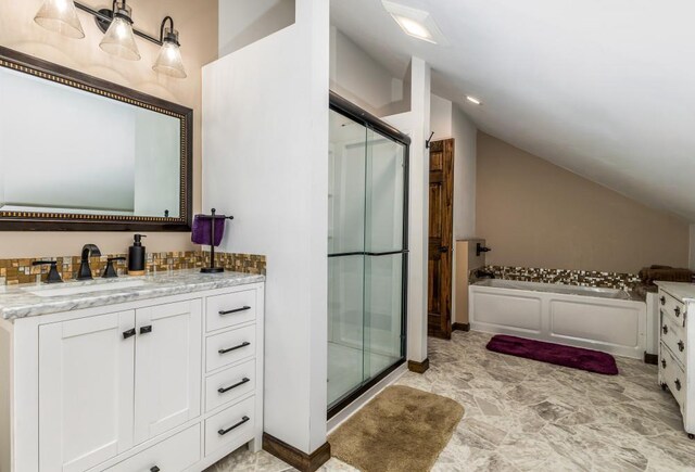 297 Debuhr Ln, Platteville, WI 53818 - full bathroom with a stall shower, lofted ceiling, a garden tub, and vanity