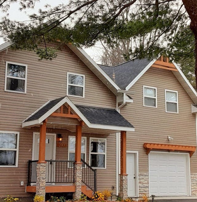 297 Debuhr Ln, Platteville, WI 53818 - view of front facade featuring a garage and a shingled roof
