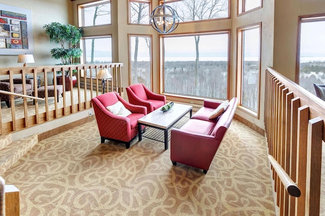 sunroom / solarium with a notable chandelier