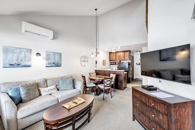 living area with a wall unit AC, light carpet, high vaulted ceiling, and a notable chandelier