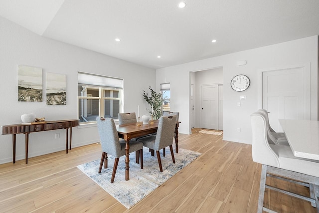 dining space with light wood-type flooring, baseboards, and recessed lighting