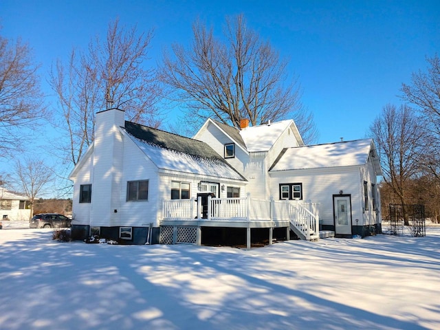 exterior space featuring a chimney and a deck