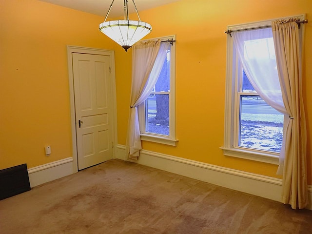 unfurnished dining area with carpet flooring