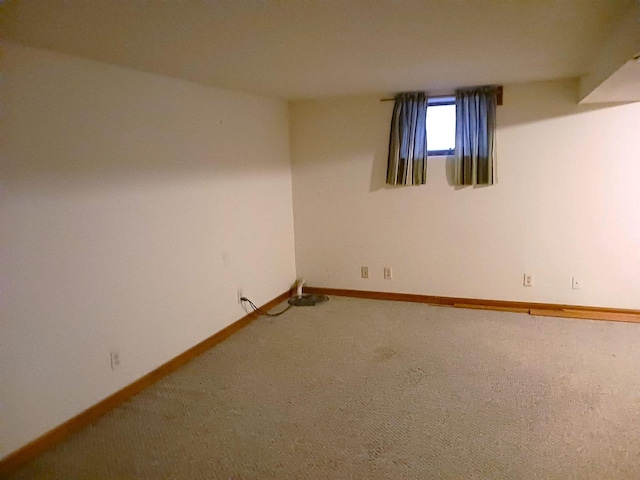 below grade area with carpet floors and baseboards