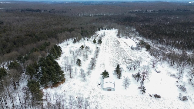 snowy aerial view with a forest view