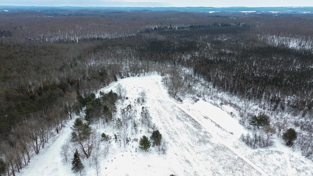 snowy aerial view with a mountain view