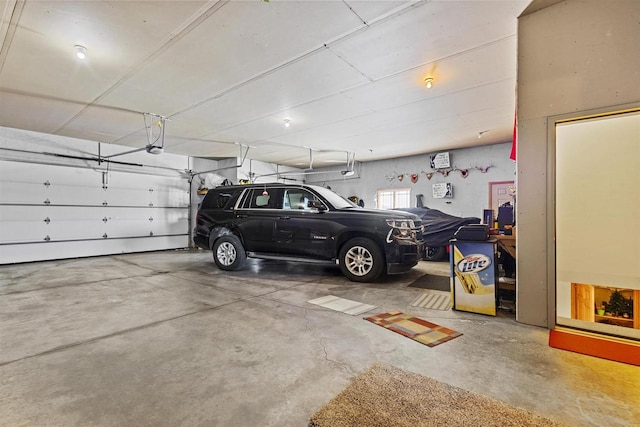 parking garage featuring a garage door opener