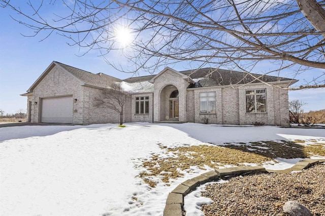 view of front of home with a garage and driveway