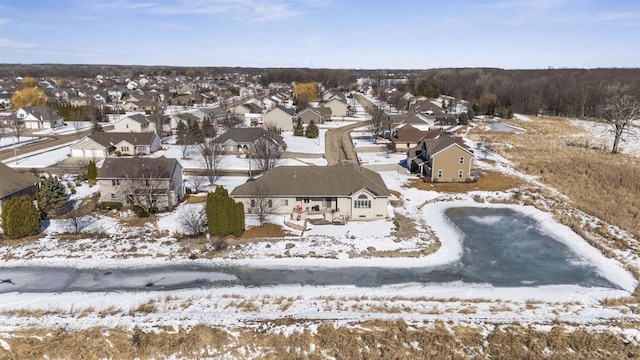 snowy aerial view featuring a residential view