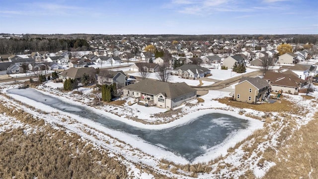 snowy aerial view with a residential view