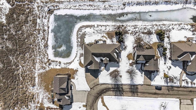 snowy aerial view featuring a residential view