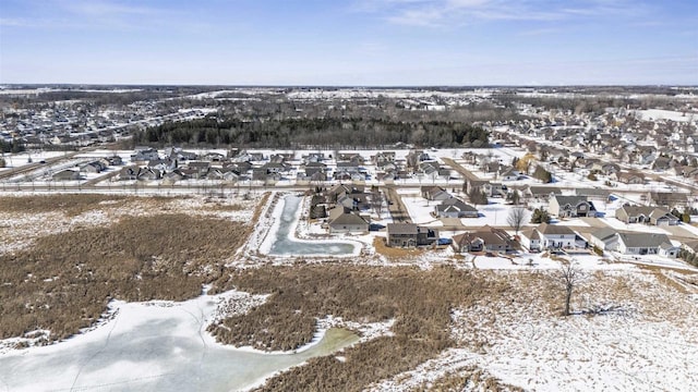 snowy aerial view featuring a residential view