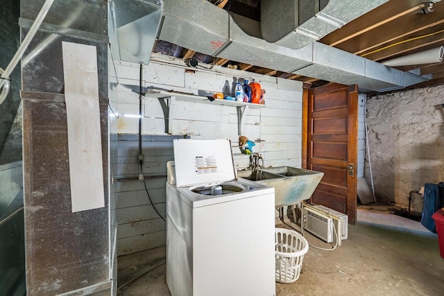 utility room featuring washer / clothes dryer and a sink