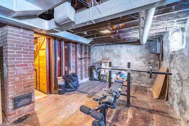 unfinished basement featuring hardwood / wood-style floors