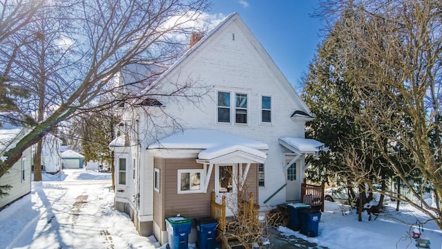 view of front of house featuring a chimney