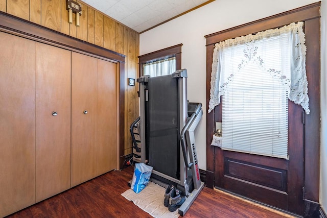 exercise room with dark wood-type flooring