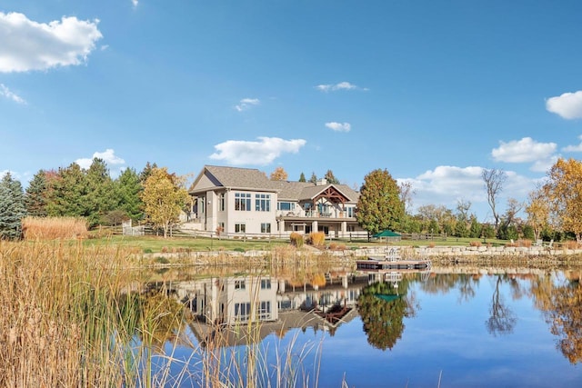 rear view of property featuring a water view