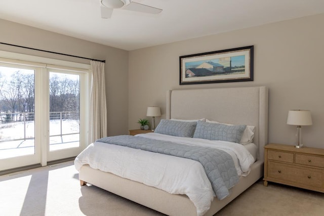 bedroom featuring a ceiling fan, light colored carpet, and access to exterior