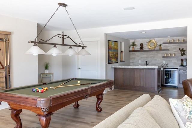 game room with pool table, beverage cooler, indoor wet bar, and dark wood-style flooring